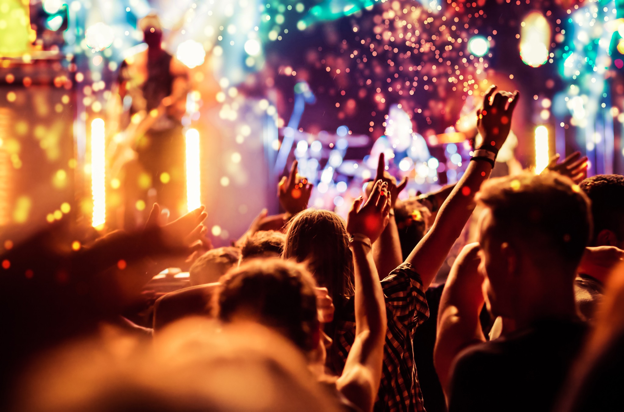 crowd with raised hands at concert - summer music festival
